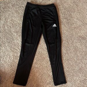 Adidas Black pants with Athletic Cut and bottom leg zipper. Youth medium